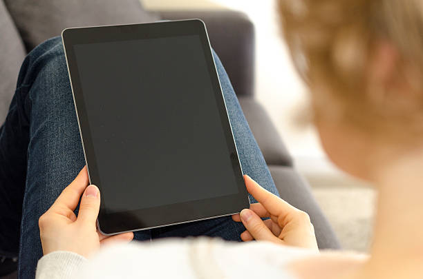 istock Blond woman looking at digital tablet computer with blank screen 624872790