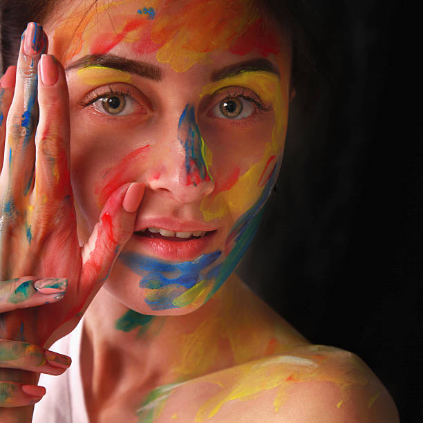istock Bright beautiful girl with art colorful make-up 624873038