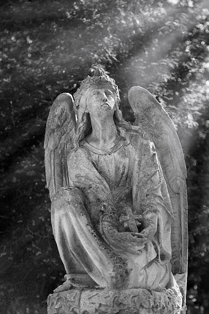 istock Vintage image of a sad angel on a cemetery 624873196