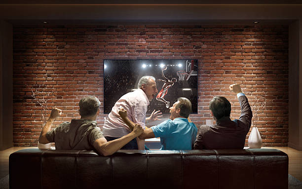 istock Adults watching Basketball game at home 624873696