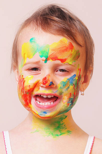 istock beautiful  little baby girl doing make up (humorous picture) 624873740