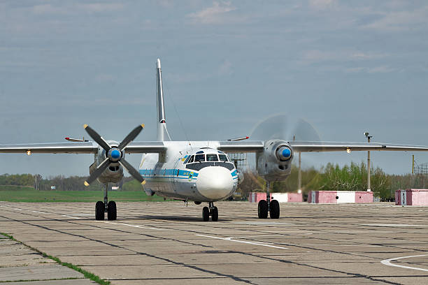 Ukrainian Air Force An-26 Vasilkov, Ukraine - April 24, 2012: Ukraine Air Force Antonov An-26 cargo plane is starting the engines before takeoff antonov an 26 stock pictures, royalty-free photos & images