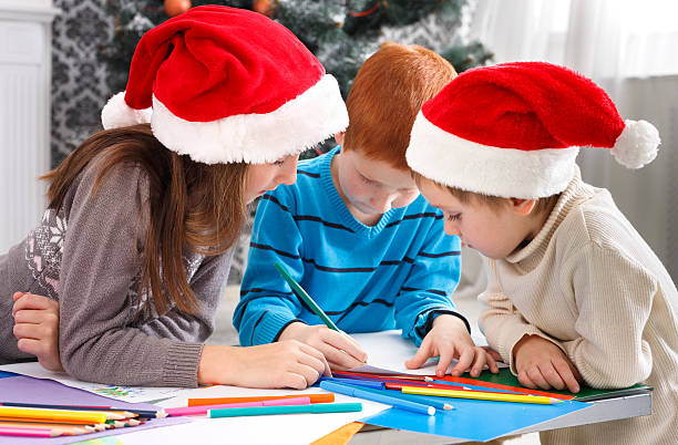 istock Children writing letter to santa, wait for christmas 624880192