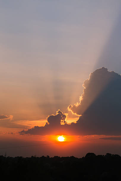 istock beautiful sunset with rays of the sun 624886064
