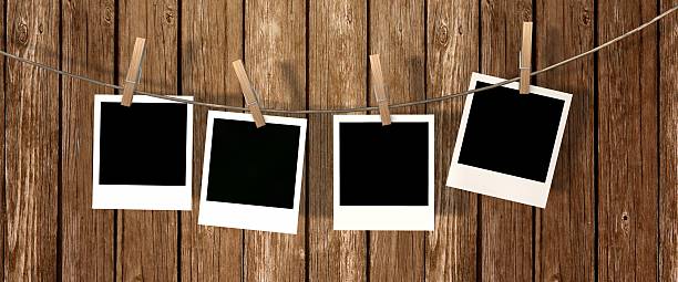 istock blank instant photos hanging on the clothesline 624887420