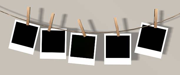 istock blank instant photos hanging on the clothesline 624887514