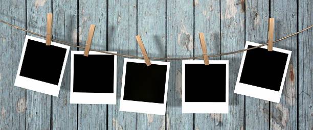 istock blank instant photos hanging on the clothesline 624888044