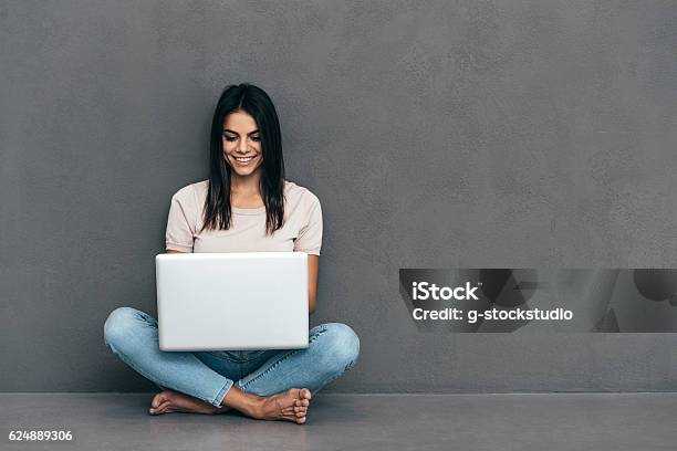 Working On Laptop Stock Photo - Download Image Now - Laptop, Women, Young Women