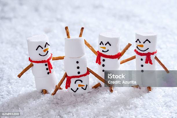 Happy Funny Marshmallow Snowmans On Snow Stock Photo - Download Image Now - Christmas, Humor, Holiday - Event