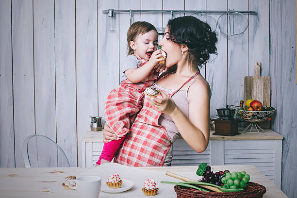 Mother and small child in the kitchen at home beautiful