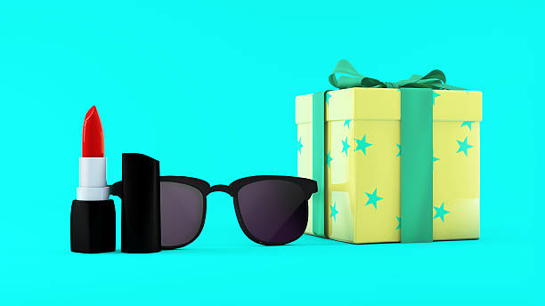 istock Red lipstick, sunglasses and giftbox on mint background. Beauty concept. 624893516