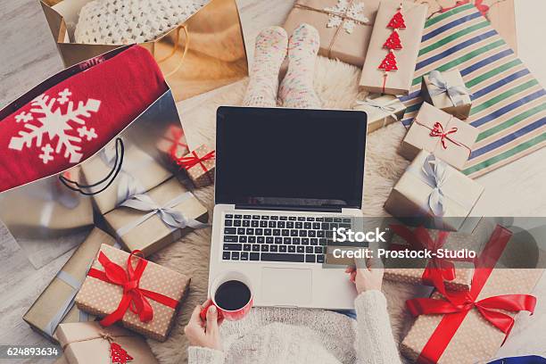 Woman Makes Christmas Shopping Online With Laptop Above View Stock Photo - Download Image Now