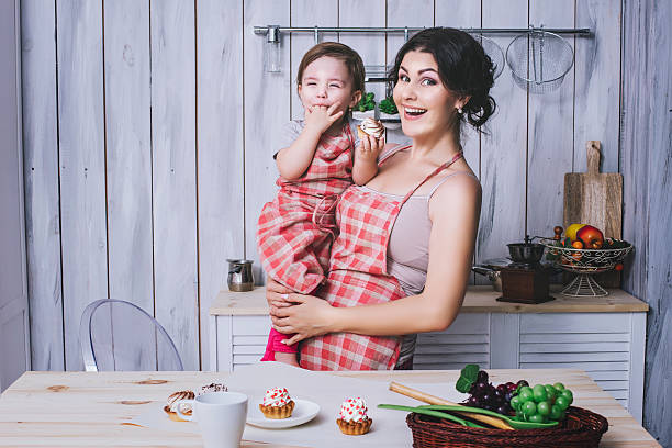 istock Mother and small child in the kitchen at home beautiful 624893744