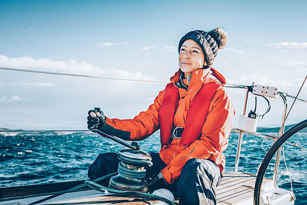 happy woman sailing during regatta - matros bildbanksfoton och bilder