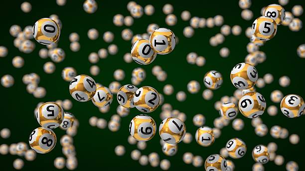 istock golden lottery balls with depth of field effect. 624896054