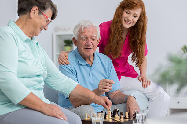 istock Senior couple and carer 624896262
