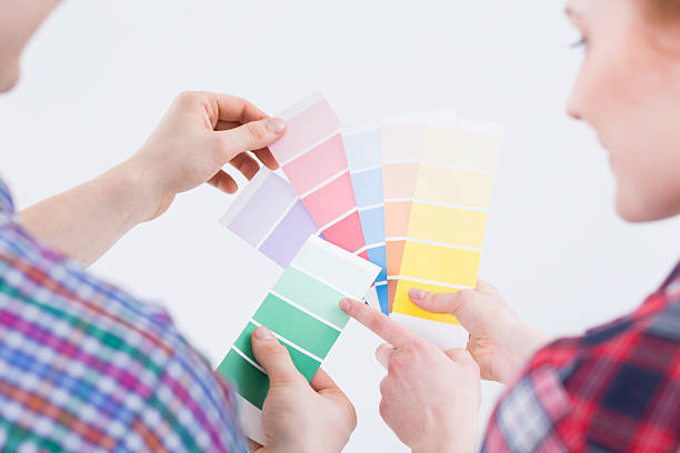 istock Man's and woman's hands taking color pickers 624898408