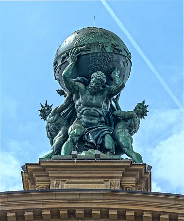 Frankfurt Am Main, Germany - May 18, 2016: Facade of Deutsche Bahn railway central station (Hauptbahnhof). Atlas God Statue