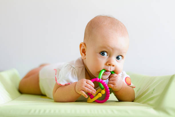 Baby girl with teething ring