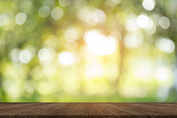 istock Wood table on shiny sunlight bokeh background. 624907582