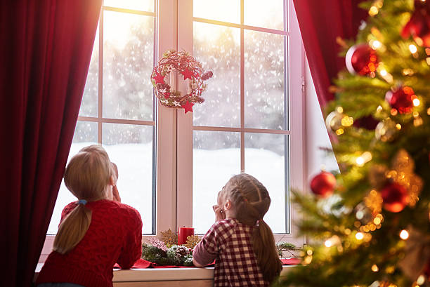 istock girls sitting by the window 624909018