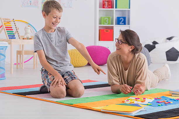 istock Babysitter and happy school-boy 624909128
