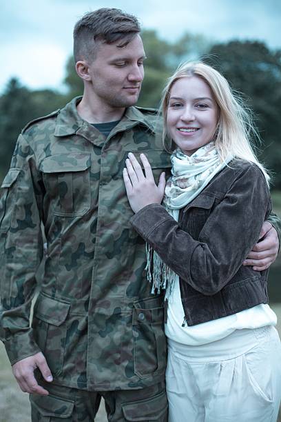 istock Soldier embracing his smiling wife 624911732