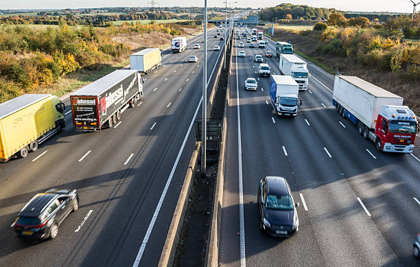 British motorway London, Uk - November 2, 2016: British M1 motorway in a rush hours. car hauling stock pictures, royalty-free photos & images