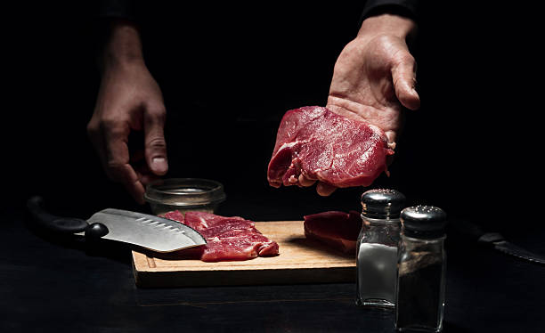 istock Close up of mans hands holding chopped meat 624923278