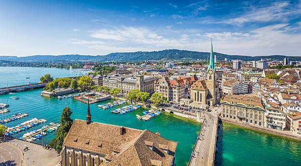 Aerial view of Zurich with river Limmat, Switzerland Aerial view of Zurich city center with famous Fraumunster Church and river Limmat at Lake Zurich from Grossmunster Church, Canton of Zurich, Switzerland. zurich photos stock pictures, royalty-free photos & images