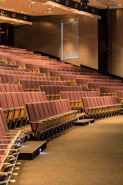 istock Lecture hall with wooden seats 624925040