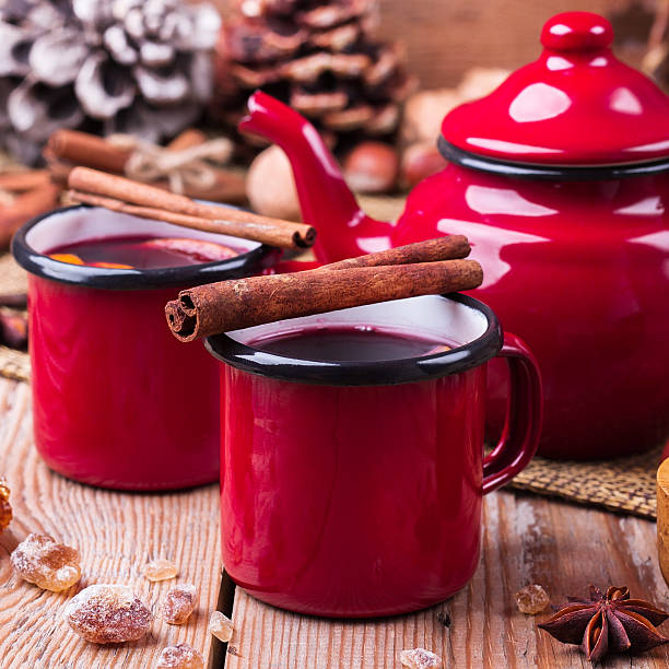istock Hot mulled wine in a red mug for winter holidays 624925214