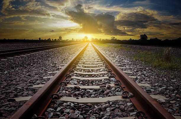 istock railroad for transportation with sunlight and silhouette, dark t 624925672
