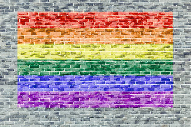 istock LGBT colorful flag color paint on brick wall. 624926772