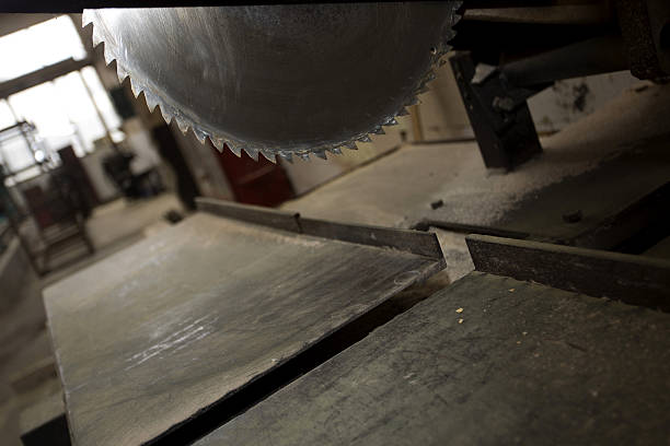 istock Detail of fixed circular buzz miter saw blade and table 624929452