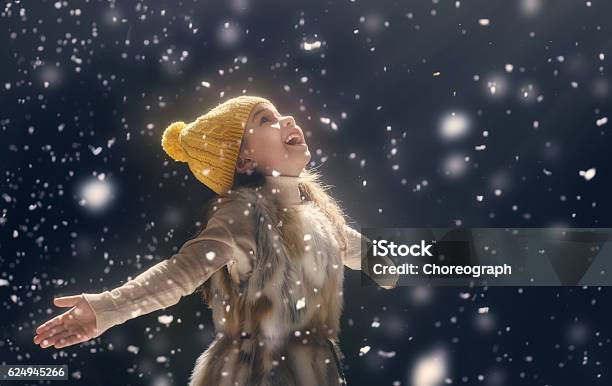 Kid On Dark Background Stock Photo - Download Image Now - Child, Christmas, Snow