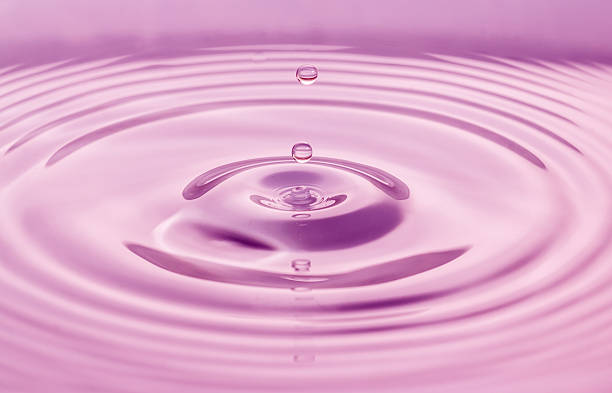 istock Water drops closeup pink background. 624946562