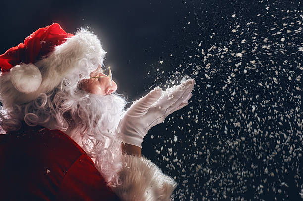 istock Santa Claus blows snow. 624948058