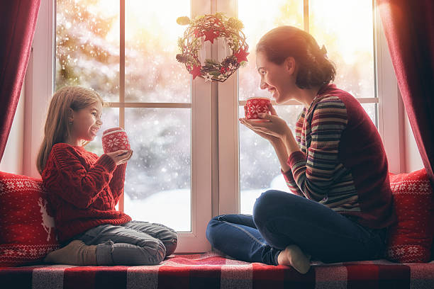 istock mother and her daughter enjoying hot tea 624950770