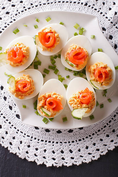 istock Eggs stuffed with salmon, cheese and cucumber closeup. vertical 624956576