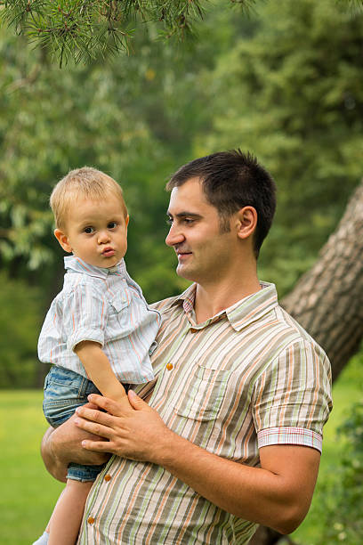 istock Father with baby son in park 624956938