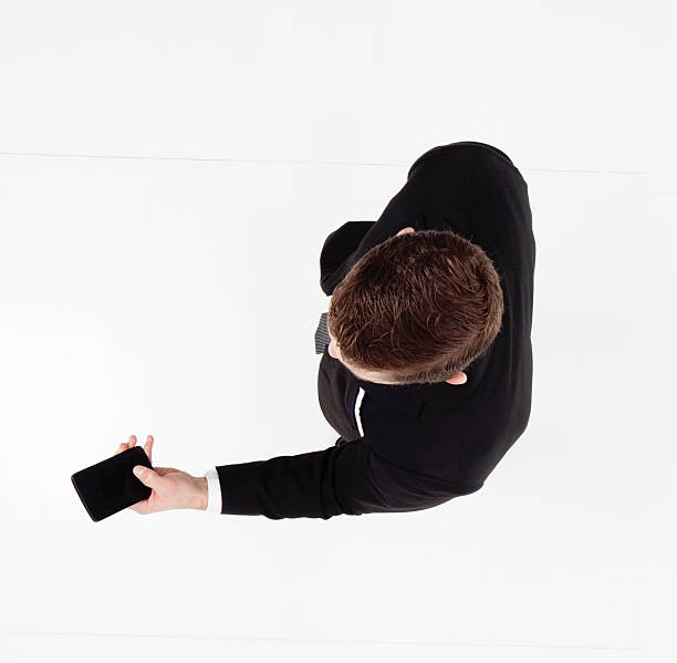 istock Above view of businessman using phone 624959430