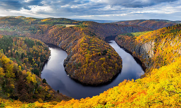 istock River canyon with dark water and autumn colorful forest 624959688