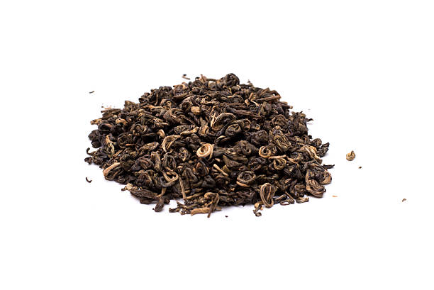 istock Pile of dried green tea isolated on white background. 624964674