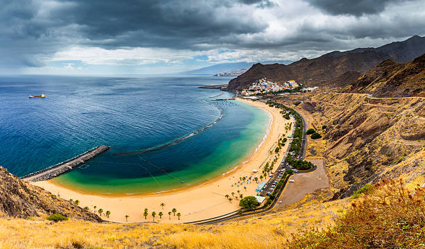 istock Beach Las Teresitas with water and waves on yellow sand 624965394