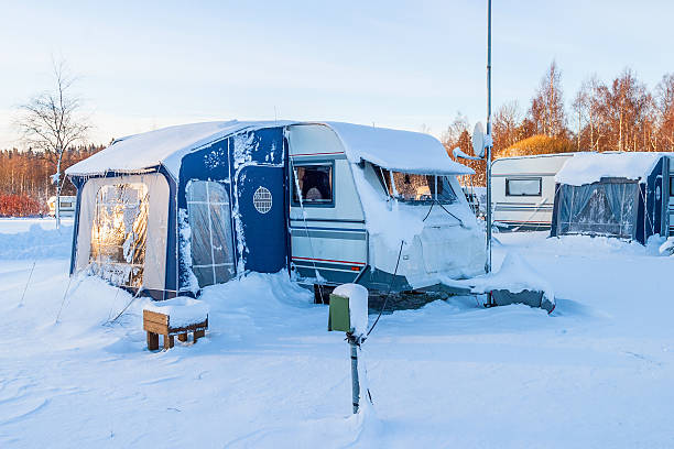 istock Snowy Winter camping with trailer 624965940