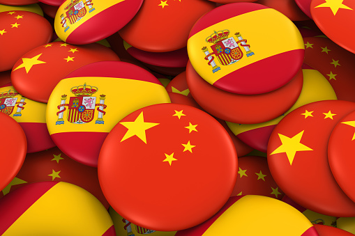 China and Spain Badges Background - Pile of Chinese and Spanish Flag Buttons 3D Illustration