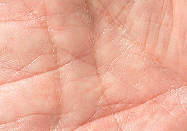 The open hand of an elderly woman is pleading for help