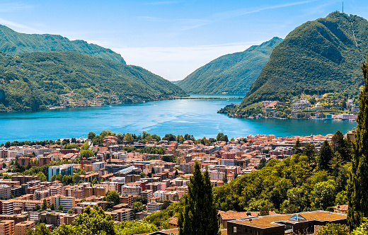 Landscape of Lugano lake, mountains and the city located below, Ticino, Switzerland