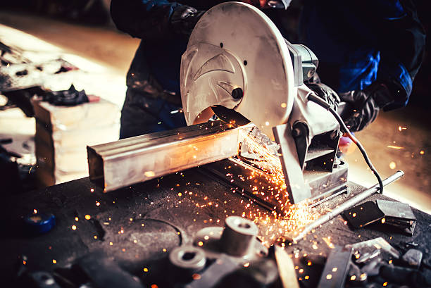 istock worker with grinding machine, power tool in factory 624968292